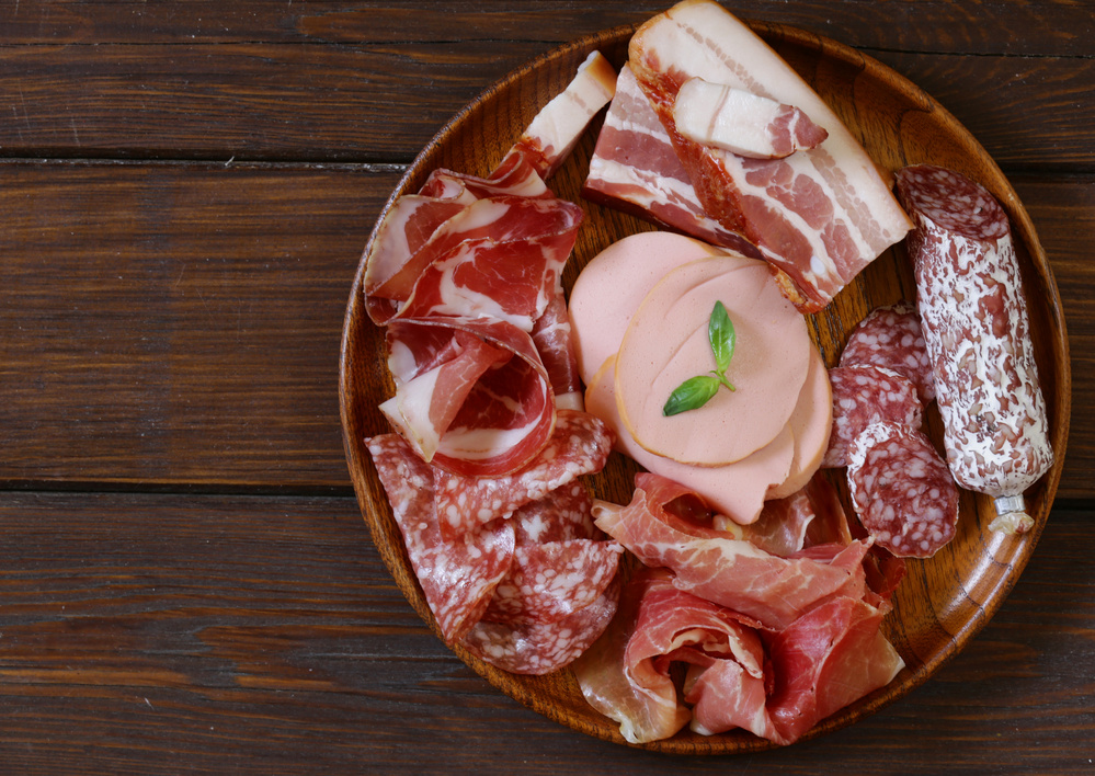Assorted Deli Meats in a Wooden Bowl